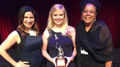 Cristina Calvet-Harrold, President and Amanda Jane Saunders-Johnston, Senior Account Manager stand with Kena Lewis, Director of Media Relations and Communications at Orlando Health.